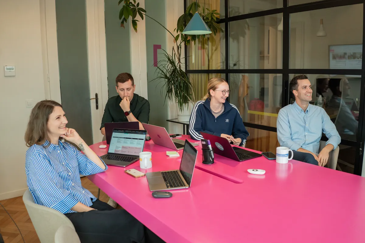 The Wolfpack team during a product workshop around the pink table